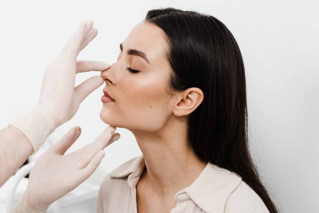 Woman at a rhinoplasty consultation at a Houston plastic surgery practice